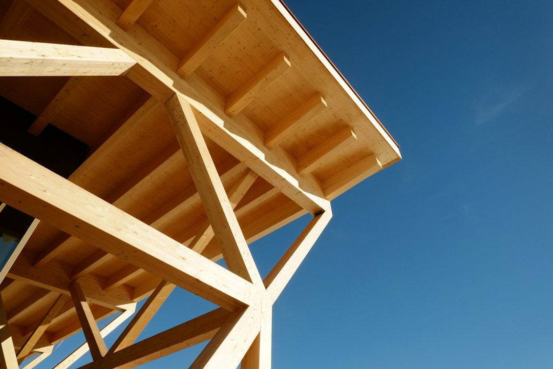 A close up of a wooden structure against a blue sky
